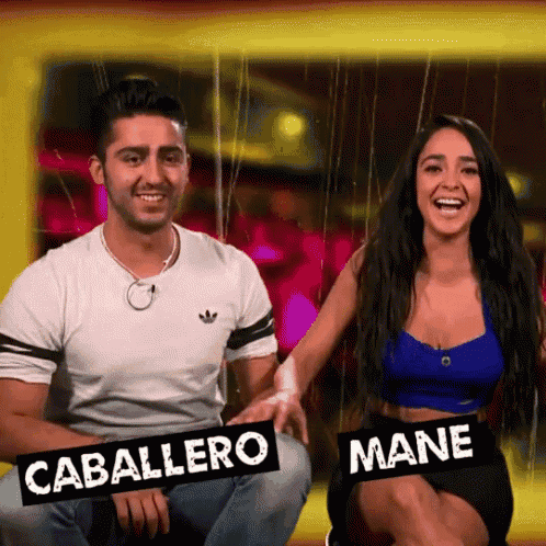 a man and a woman sitting next to each other with a sign that says caballero and mane