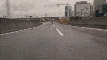 a person is riding a motorcycle on a highway