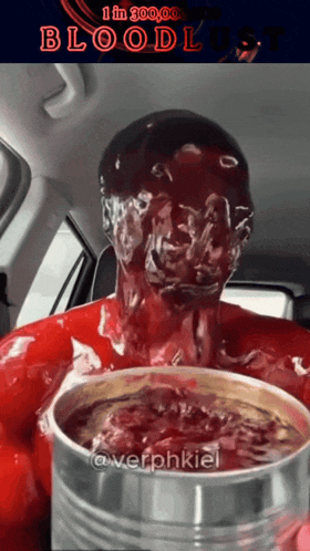 a man covered in blood is holding a can
