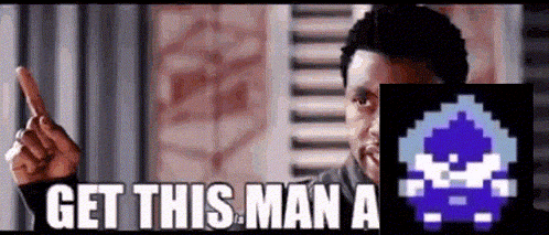 a man is pointing at a pixelated image of a man with the words `` get this man a '' written on it .