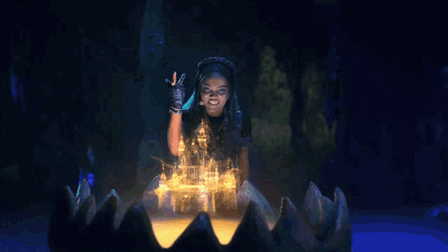 a woman is surrounded by a glowing octopus in a dark room