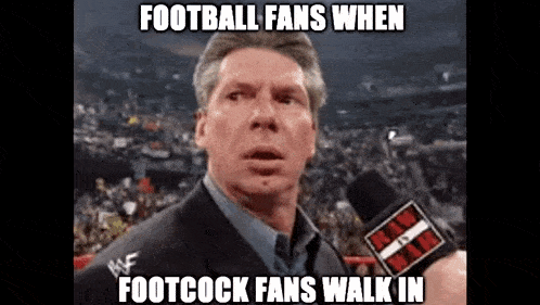 a man in a suit is talking into a microphone with a caption that reads football fans when footcock fans walk in .