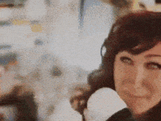 a close up of a woman wearing headphones and a microphone