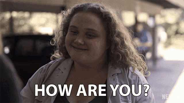 a woman with curly hair is asking how are you