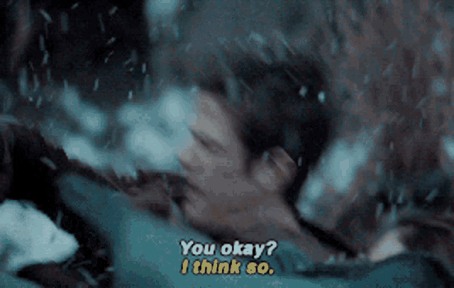 a man is being held by a woman and says you okay i think so