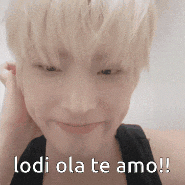 a close up of a person 's face with the words lodi ola te amo written below it