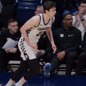 a basketball player wearing a white jersey that says dawgs on it