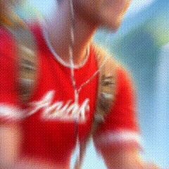 a blurred image of a person wearing a red shirt that says ariel
