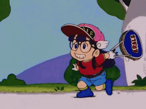 a cartoon character named arale is running with a drum in her hand