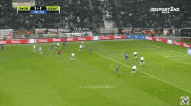 a soccer game is being played on a field with advertisements for bikocs