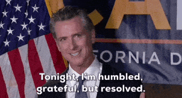 a man in front of an american flag says tonight i 'm humbled grateful but resolved