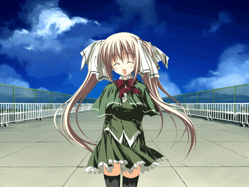 a girl in a green dress stands on a rooftop with a blue sky in the background