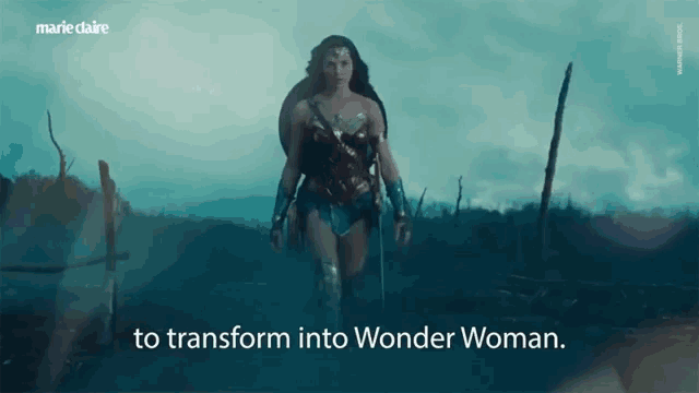 a woman in a wonder woman costume is walking in a field