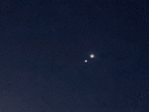 a dark blue sky with a few stars visible