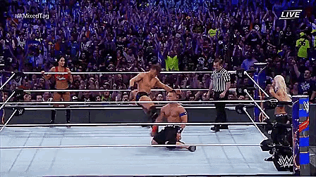 a wrestling match is being shown live on a television screen