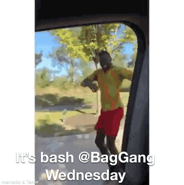a man in a yellow shirt and red shorts is dancing in a car window with the words it 's bash @baggang wednesday