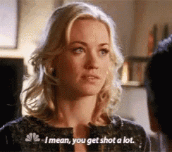 a blonde woman is talking to a man and says i mean you get shot a lot .