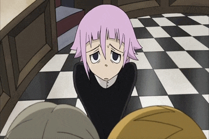 a girl with pink hair is sitting on a checkerboard floor