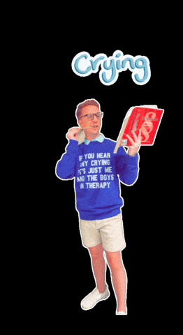 a man wearing a blue shirt that says " crying in a cool way " is holding a book