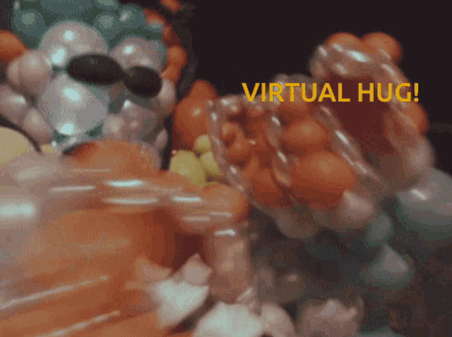 a bunch of balloons with the words virtual hug on the bottom