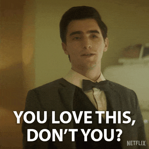 a man in a suit says " you love this , don 't you "