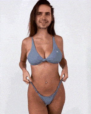 a woman in a bikini with a man in her face