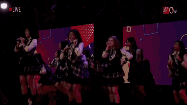 a group of people are dancing in a dark room with the words live on the bottom