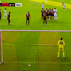 a soccer game is being played with the score 0-1