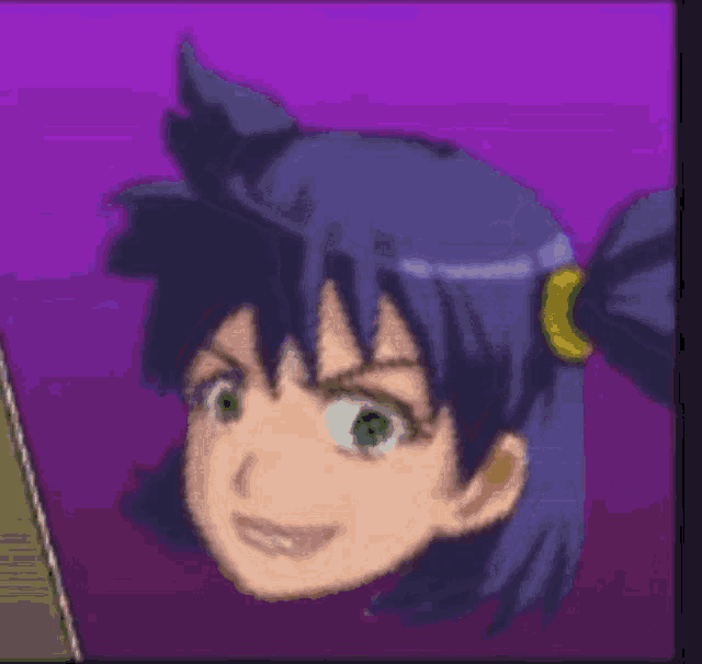 a pixelated image of a girl with a ponytail and green eyes