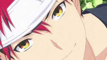 a close up of a person with red hair and a white headband
