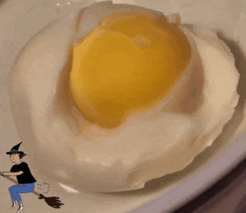 a cartoon of a witch on a broom next to a boiled egg