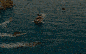 a boat that has a red and white stripe on the side