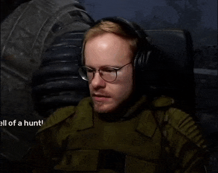a man wearing glasses and headphones says " oh no "