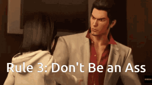 a man in a suit and red shirt is talking to a woman in a white hoodie with rule 3 don 't be an ass