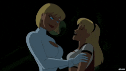 a cartoon of two women standing next to each other in a dark room