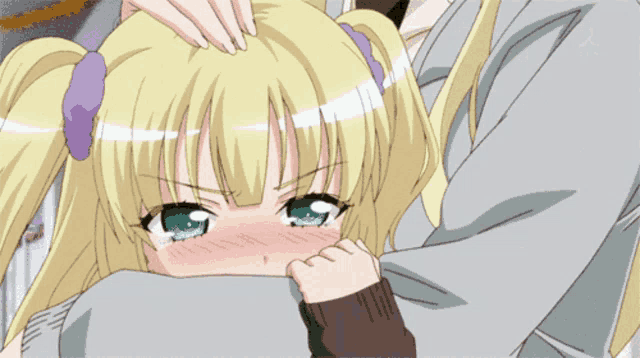 a girl with blonde hair and green eyes is covering her face with her hand