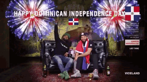 two men sit on a couch in front of a fireworks display that says " happy dominican independence day "
