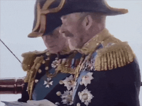 a man in a military uniform has a medal on his chest with a cross on it
