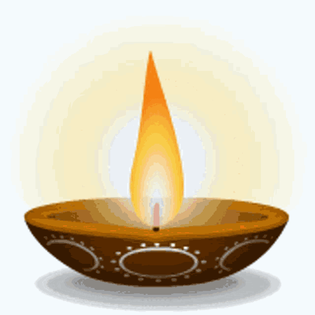 a candle is lit in a brown bowl with circles on it