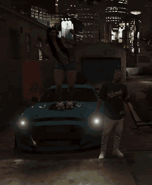 a man in a nationals shirt stands next to a woman standing on top of a car