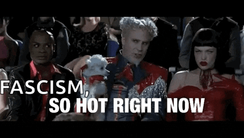 a group of people sitting in a theater with the words fascism so hot right now