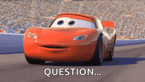 a lightning mcqueen from cars is driving down a race track and says question .