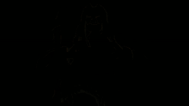 a person is standing in the dark with a light coming out of their chest .