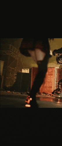 a person in a red dress is kicking a monster