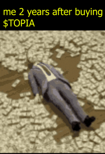 a man in a suit is laying on the ground covered in money