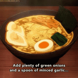 a bowl of ramen with green onions and a spoon of minced garlic on a table