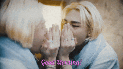a man whispering into a mirror with the words good morning