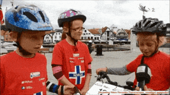 a girl wearing a shirt that says norge is being interviewed