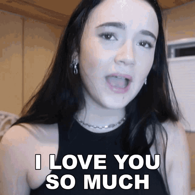 a woman says " i love you so much " in front of her face