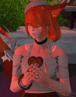 a girl with red hair and a white hat is holding a heart shaped chocolate